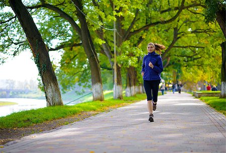 simsearch:6109-06004563,k - Young Beautiful Woman Running in the Autumn Park. Active Lifestyle Stockbilder - Microstock & Abonnement, Bildnummer: 400-07921074