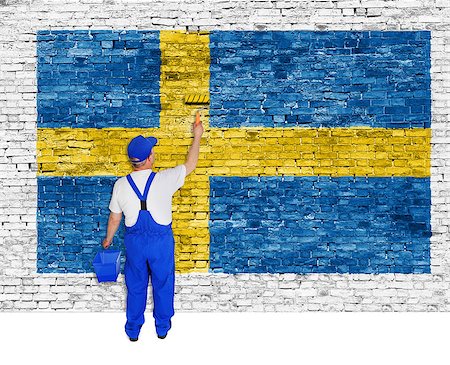 simsearch:400-08403526,k - Professional house painter covers brick wall with flag of Sweden Fotografie stock - Microstock e Abbonamento, Codice: 400-07921286