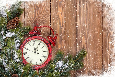 Christmas wooden background with clock, snow fir tree and copy space Stock Photo - Budget Royalty-Free & Subscription, Code: 400-07921398