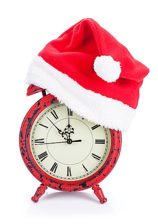 Christmas clock with santa hat. Isolated on white background Stock Photo - Budget Royalty-Free & Subscription, Code: 400-07921392