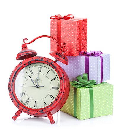 Christmas clock and three gift boxes. Isolated on white background Stock Photo - Budget Royalty-Free & Subscription, Code: 400-07921393