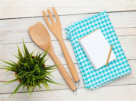 empty tabletop - Kitchen utensil and notepad over white wooden table background. View from above with copy space Stock Photo - Budget Royalty-Free & Subscription, Code: 400-07921444