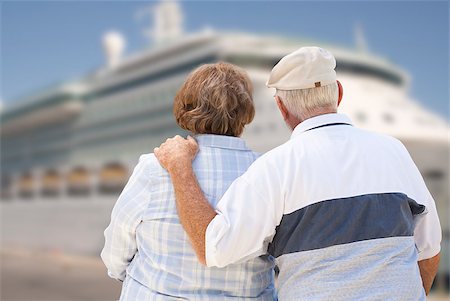 Senior Couple On Shore Facing and Looking at Docked Cruise Ship. Stock Photo - Budget Royalty-Free & Subscription, Code: 400-07921552