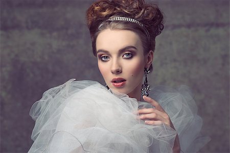 charming female wearing like baroque retro dame posing in creative fashion portrait with elegant hair-style, precious tiara and earrings, vintage romantic dress with frill veil collar and stylish make-up. Photographie de stock - Aubaine LD & Abonnement, Code: 400-07922622