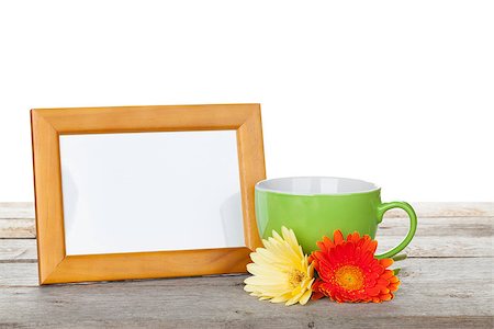 simsearch:400-07662543,k - Photo frame on wooden table with cup of coffee and gerbera flowers Stock Photo - Budget Royalty-Free & Subscription, Code: 400-07922752
