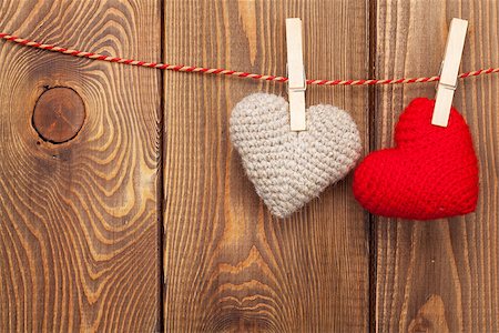 simsearch:400-07922855,k - Handmaded toy valentines hearts on rope over wooden background with copy space Foto de stock - Super Valor sin royalties y Suscripción, Código: 400-07922846