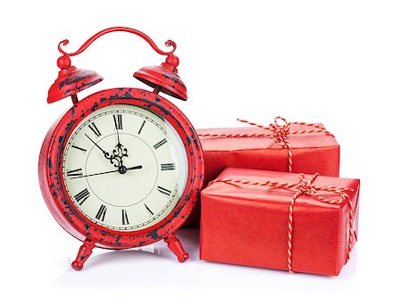 Christmas clock and two gift boxes. Isolated on white background Foto de stock - Super Valor sin royalties y Suscripción, Código: 400-07922840