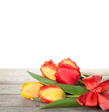 Fresh tulips bouquet over wooden table with copy space Stock Photo - Budget Royalty-Free & Subscription, Code: 400-07922912