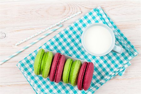 Cup of milk and macarons on white wooden table Stock Photo - Budget Royalty-Free & Subscription, Code: 400-07934017