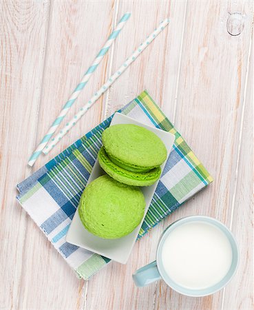 Cup of milk and macarons on white wooden table Stock Photo - Budget Royalty-Free & Subscription, Code: 400-07934018