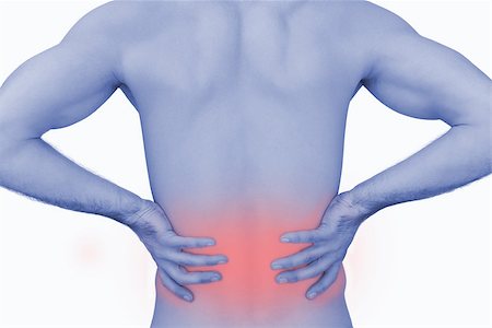 Rear view of muscular man with backache over white background Photographie de stock - Aubaine LD & Abonnement, Code: 400-07934257