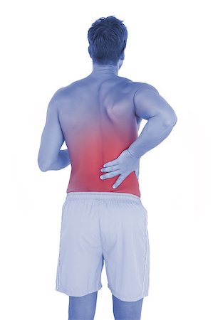 Man with shorts suffering from back pain on white background Photographie de stock - Aubaine LD & Abonnement, Code: 400-07934427