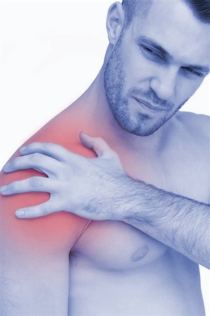 simsearch:6109-06684724,k - Closeup of shirtless man with shoulder pain over white background Stock Photo - Budget Royalty-Free & Subscription, Code: 400-07934429