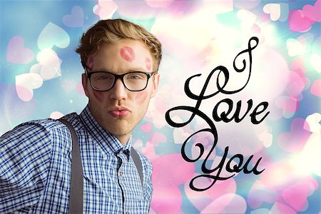 simsearch:400-07957805,k - Geeky hipster covered in kisses against valentines heart design Photographie de stock - Aubaine LD & Abonnement, Code: 400-07934475