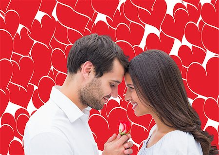 simsearch:400-07957006,k - Handsome man offering his girlfriend a rose against valentines day pattern Stock Photo - Budget Royalty-Free & Subscription, Code: 400-07934575