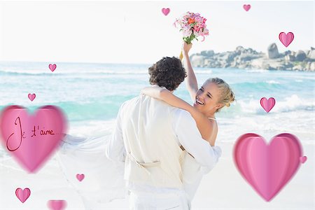 simsearch:400-07664797,k - Handsome groom carrying his beautiful laughing wife against valentines love hearts Stock Photo - Budget Royalty-Free & Subscription, Code: 400-07934944