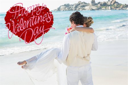 simsearch:400-07664797,k - Handsome groom carrying his beautiful wife out to the water against happy valentines day Stock Photo - Budget Royalty-Free & Subscription, Code: 400-07934945