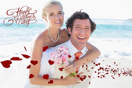 simsearch:400-07664797,k - Handsome groom giving his new wife a piggy back against happy valentines day Stock Photo - Budget Royalty-Free & Subscription, Code: 400-07934943