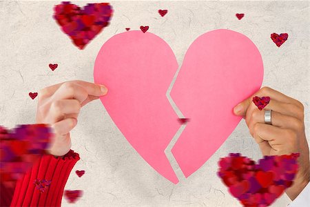 simsearch:400-08980419,k - Couple holding two halves of broken heart against parchment Stock Photo - Budget Royalty-Free & Subscription, Code: 400-07935046
