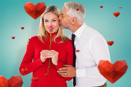 simsearch:400-07957627,k - Handsome man giving his wife a kiss on cheek against blue vignette background Foto de stock - Super Valor sin royalties y Suscripción, Código: 400-07935050