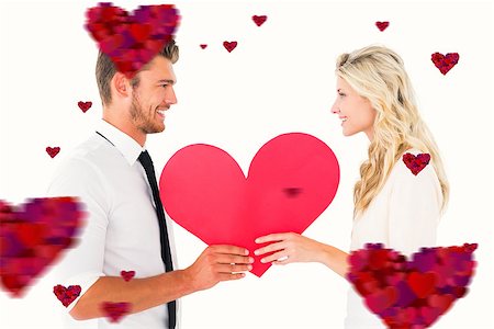 simsearch:400-07686530,k - Attractive young couple holding red heart against hearts Foto de stock - Royalty-Free Super Valor e Assinatura, Número: 400-07935198