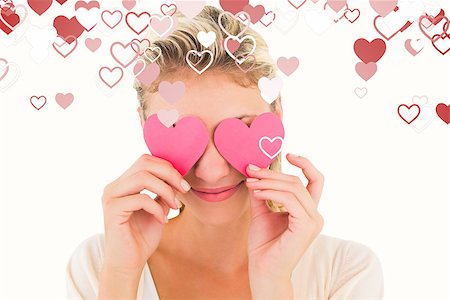 simsearch:400-07726694,k - Attractive young blonde holding hearts over eyes against valentines heart design Foto de stock - Royalty-Free Super Valor e Assinatura, Número: 400-07935205