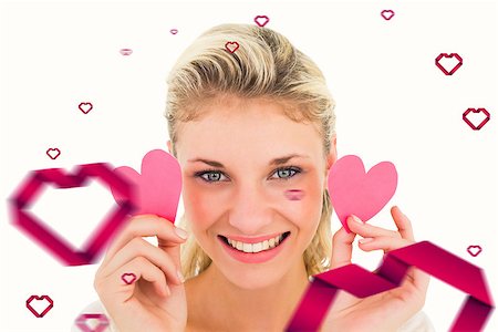 simsearch:400-07686534,k - Attractive young blonde holding little hearts  against hearts Foto de stock - Royalty-Free Super Valor e Assinatura, Número: 400-07935201