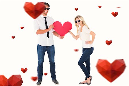 simsearch:400-07686530,k - Cool young couple holding red heart against hearts Foto de stock - Royalty-Free Super Valor e Assinatura, Número: 400-07935203