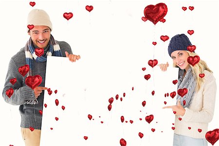 floating balloon woman caucasian - Attractive couple in winter fashion showing poster against red heart balloons floating Stock Photo - Budget Royalty-Free & Subscription, Code: 400-07935210