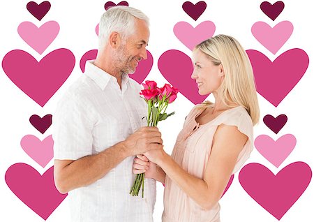 simsearch:400-07957006,k - Affectionate man offering his partner roses against valentines day pattern Stock Photo - Budget Royalty-Free & Subscription, Code: 400-07935294