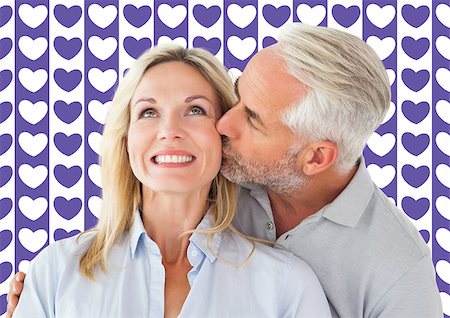 simsearch:400-07957006,k - Affectionate man kissing his wife on the cheek  against valentines day pattern Stock Photo - Budget Royalty-Free & Subscription, Code: 400-07935291