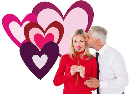 simsearch:400-07957006,k - Handsome man giving his wife a kiss on cheek against valentines love hearts Stock Photo - Budget Royalty-Free & Subscription, Code: 400-07935300