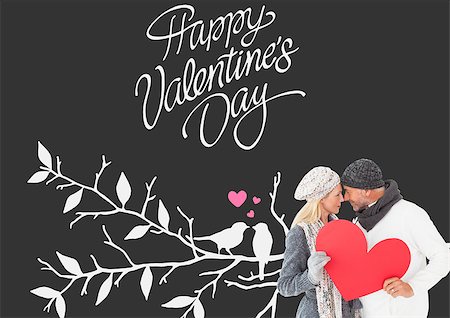 simsearch:400-07957430,k - Smiling couple in winter fashion posing with heart shape against cute valentines message Photographie de stock - Aubaine LD & Abonnement, Code: 400-07935327