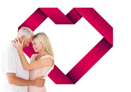 simsearch:400-07935196,k - Affectionate couple standing and hugging against heart Foto de stock - Royalty-Free Super Valor e Assinatura, Número: 400-07935334