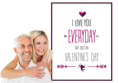 simsearch:400-07957805,k - Happy man giving his partner a piggy back against valentines day greeting Photographie de stock - Aubaine LD & Abonnement, Code: 400-07935336