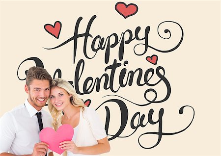 simsearch:400-07935196,k - Attractive young couple holding pink heart against happy valentines day Foto de stock - Royalty-Free Super Valor e Assinatura, Número: 400-07935349