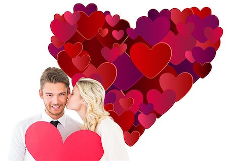 simsearch:400-07686530,k - Attractive young couple holding red heart against heart Foto de stock - Royalty-Free Super Valor e Assinatura, Número: 400-07935351