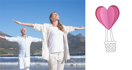 Happy couple standing with arms outstretched at the beach against heart hot air balloon Stock Photo - Budget Royalty-Free & Subscription, Code: 400-07935591