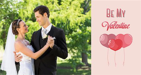 Couple dancing on wedding day against cute valentines message Stock Photo - Budget Royalty-Free & Subscription, Code: 400-07935728