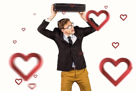 simsearch:400-08020381,k - Young geeky businessman holding briefcase against hearts Fotografie stock - Microstock e Abbonamento, Codice: 400-07935773