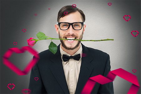 simsearch:400-08020381,k - Geeky hipster holding rose between teeth against white background with vignette Fotografie stock - Microstock e Abbonamento, Codice: 400-07935834
