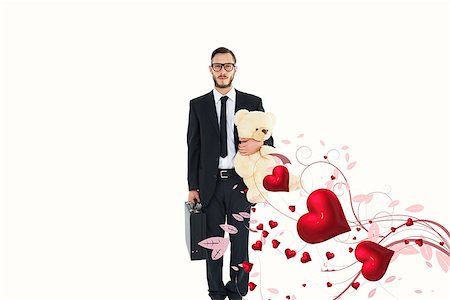 simsearch:400-08020381,k - Geeky businessman holding briefcase and teddy against valentines heart design Fotografie stock - Microstock e Abbonamento, Codice: 400-07935844