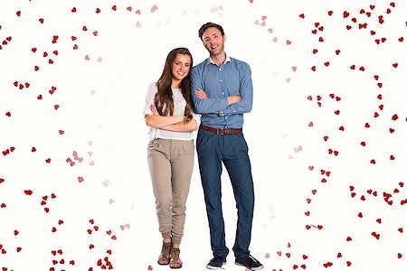 Smiling young couple with arms crossed against red love hearts Stock Photo - Budget Royalty-Free & Subscription, Code: 400-07935907