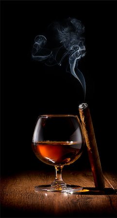 Wineglass of scotch and cigar on wooden table Stock Photo - Budget Royalty-Free & Subscription, Code: 400-07936318