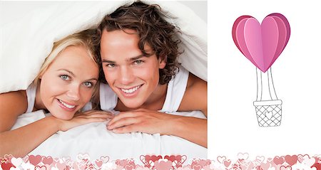 Couple under a duvet against heart hot air balloon Stock Photo - Budget Royalty-Free & Subscription, Code: 400-07936652