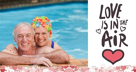 Happy mature couple in the swimming pool  against love is in the air Stock Photo - Budget Royalty-Free & Subscription, Code: 400-07936670