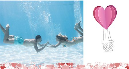 Cute couple holding hands underwater in the swimming pool against heart hot air balloon Stock Photo - Budget Royalty-Free & Subscription, Code: 400-07936695