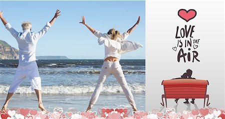 Couple jumping on the beach together against love is in the air Stock Photo - Budget Royalty-Free & Subscription, Code: 400-07936690