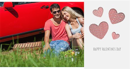 simsearch:400-07058112,k - Smiling couple sitting on the grass having picnic together against cute valentines message Photographie de stock - Aubaine LD & Abonnement, Code: 400-07936877