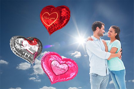 simsearch:400-07936959,k - Attractive young couple hugging each other against cloudy sky with sunshine Foto de stock - Royalty-Free Super Valor e Assinatura, Número: 400-07936947